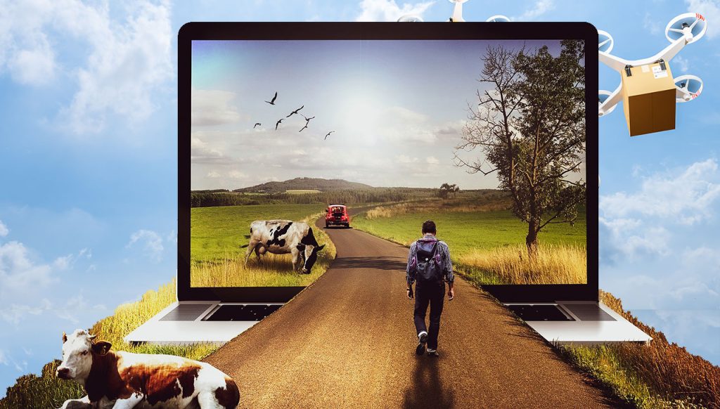 Mies reppu selässä kävelemässä maalaismaiseman keskellä olevaa tietä, joka jatkuu tietokoneen näytön sisälle.